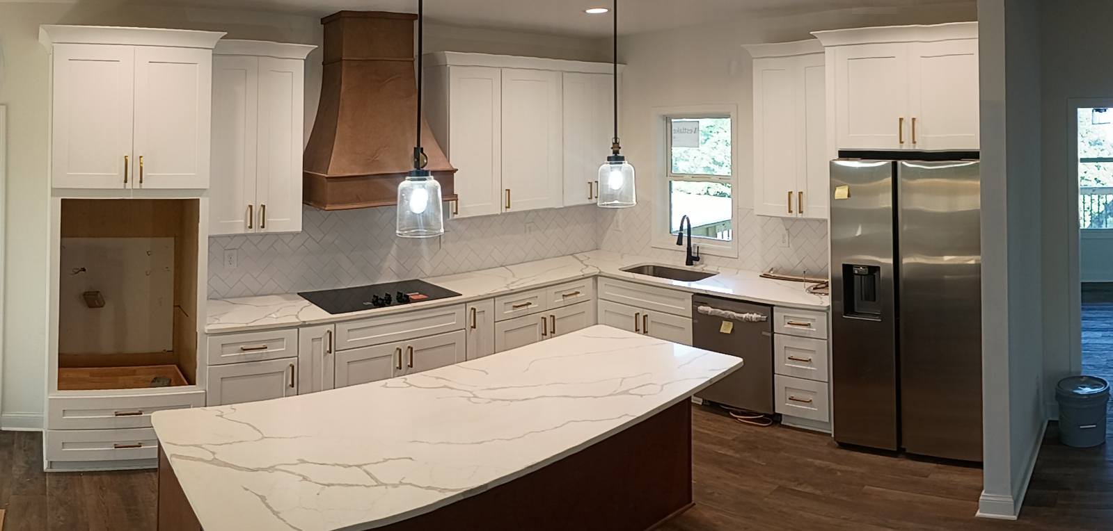 Custom cabinetry with copper range hood
